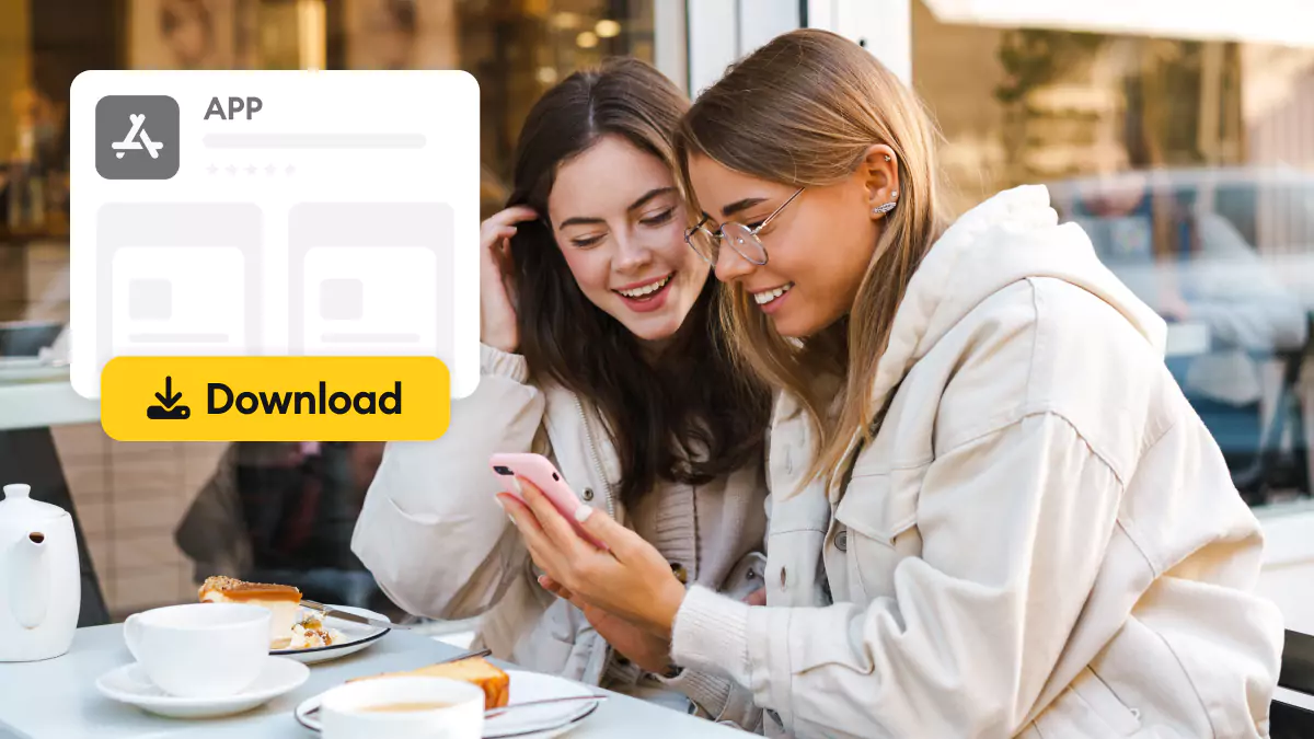 two friends downloading apps for their smartphone