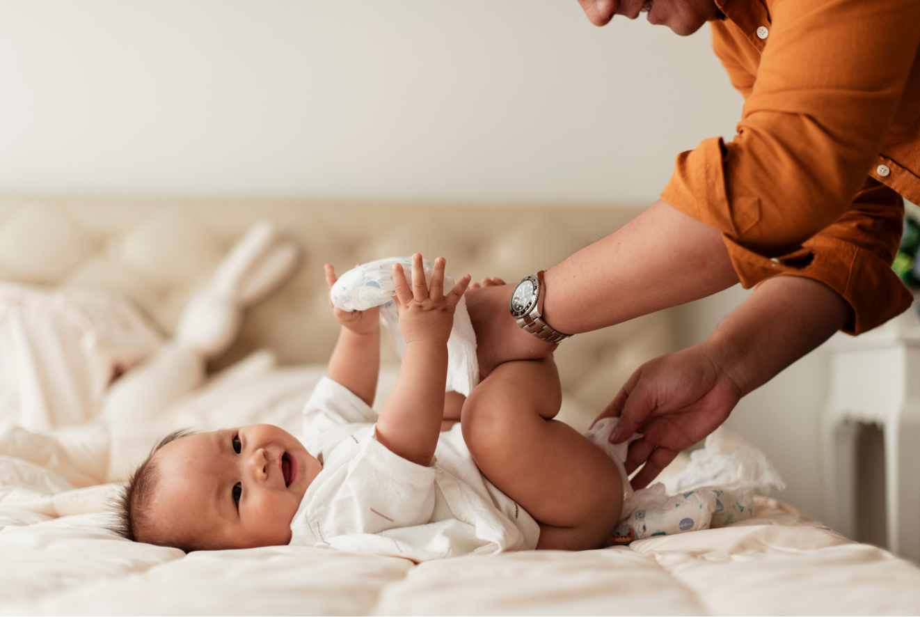 Man changing babys diaper