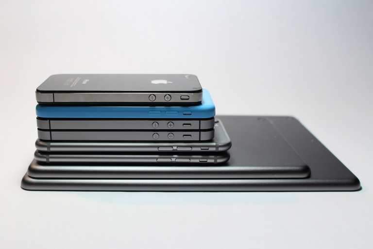 A pile of mobile and tablet devices