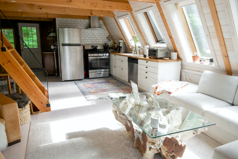 Natural light fills an open-plan living room and kitchen