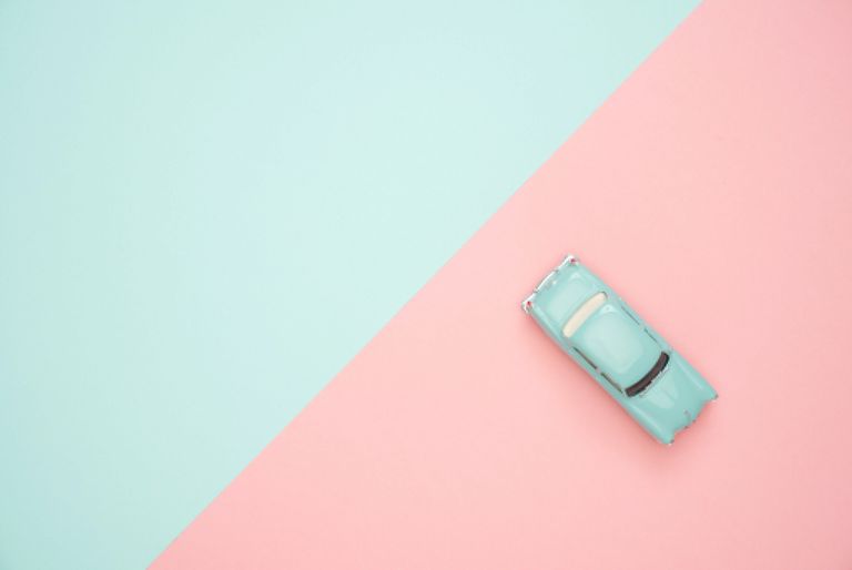 A toy car on colourful background