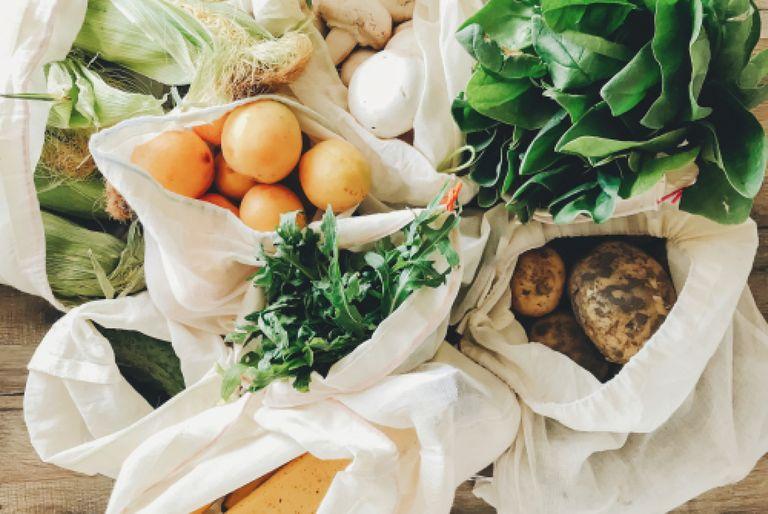 Veggies in reusable cloth bags to reduce carbon footprint