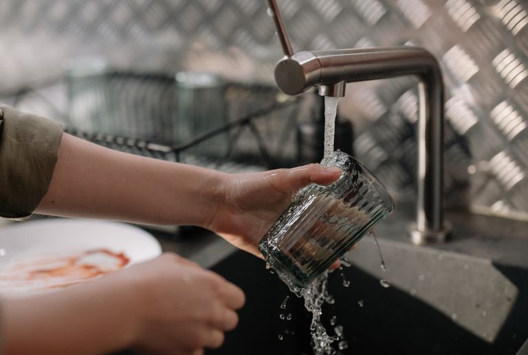 Person Handwashing a cup