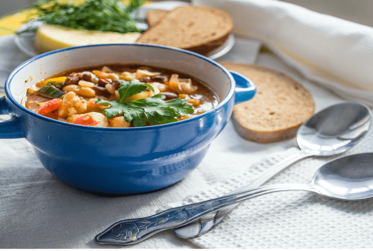 Vegan soup with beans in a blue bowl