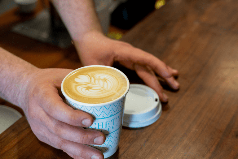 Latte coffee in single-use cup