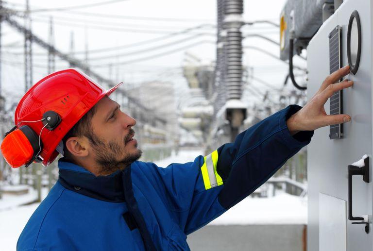 Man inspecting nuclear plant machine