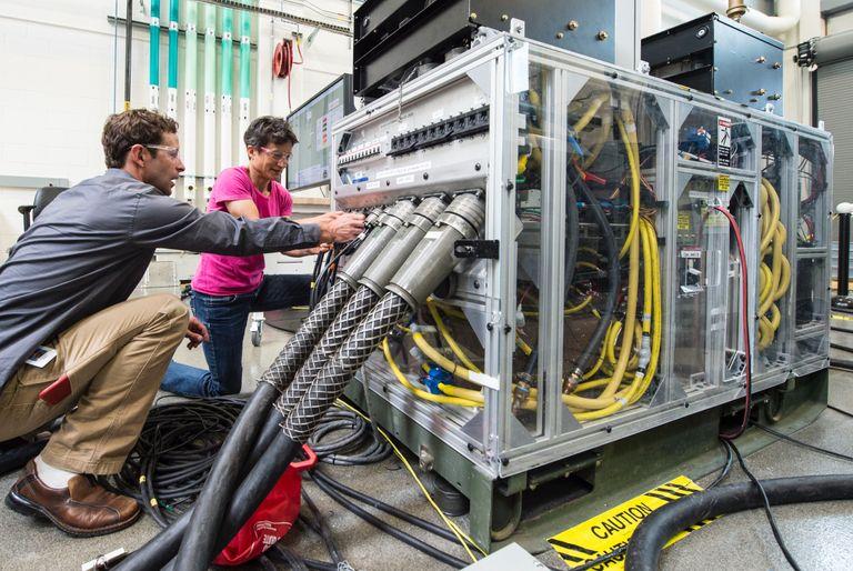 environmental engineers working on machine