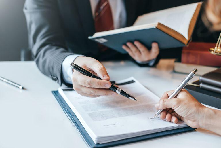 environmental lawyer pointing at contract