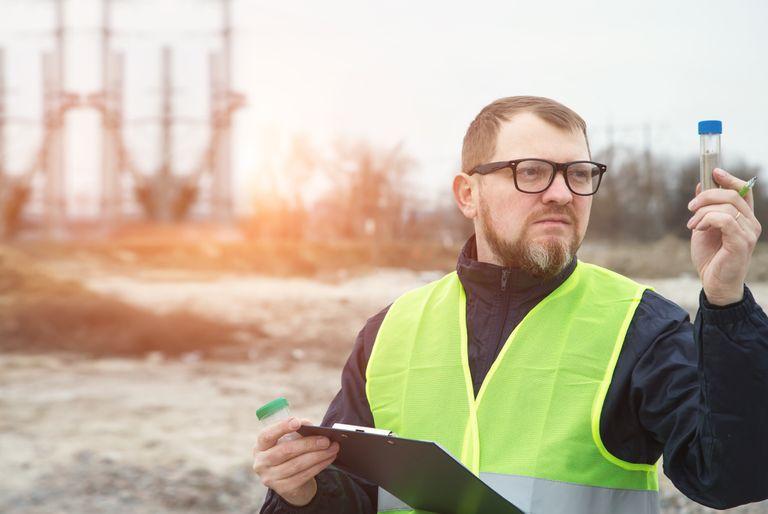 environmental assessor in the field checkin soil