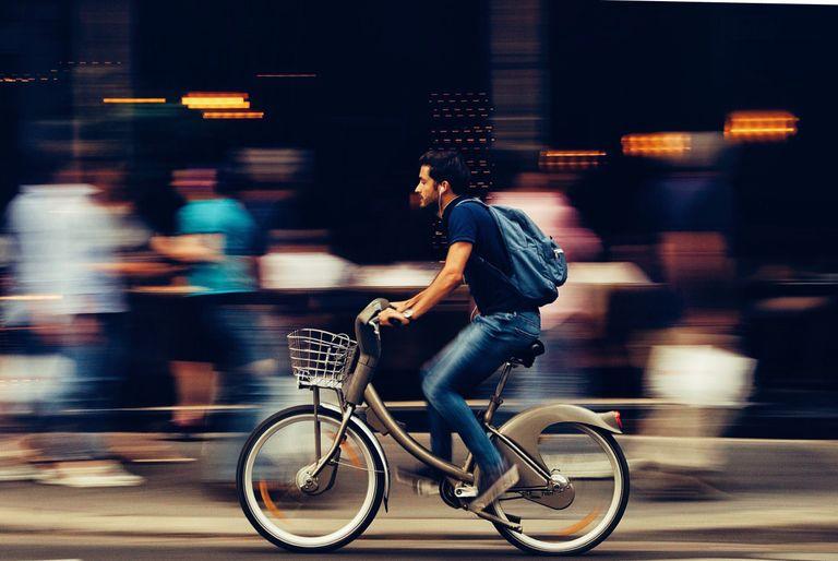 man riding a bike instead driving to work