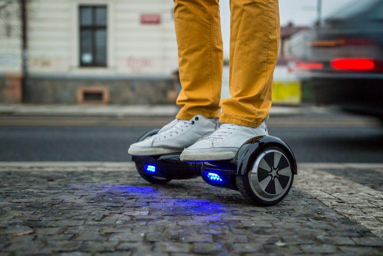 Man standing on an electric hoverboard