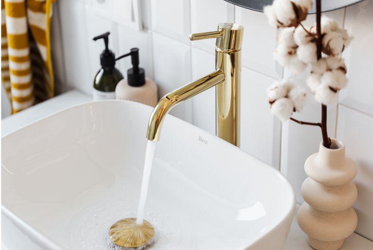 Golden tap in the bathroom