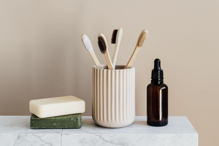 Eco friendly products including tooth brushes and soap on a marble slab