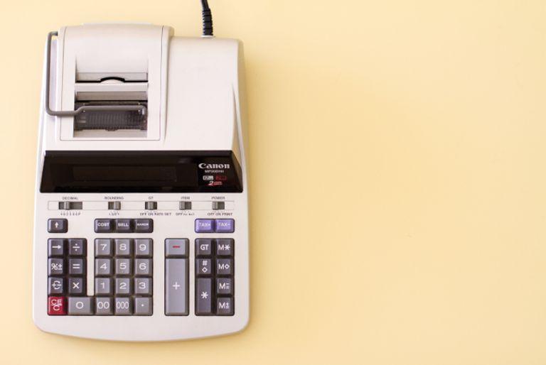 How to calculate carbon footprints symbolized by an old financial calculator.