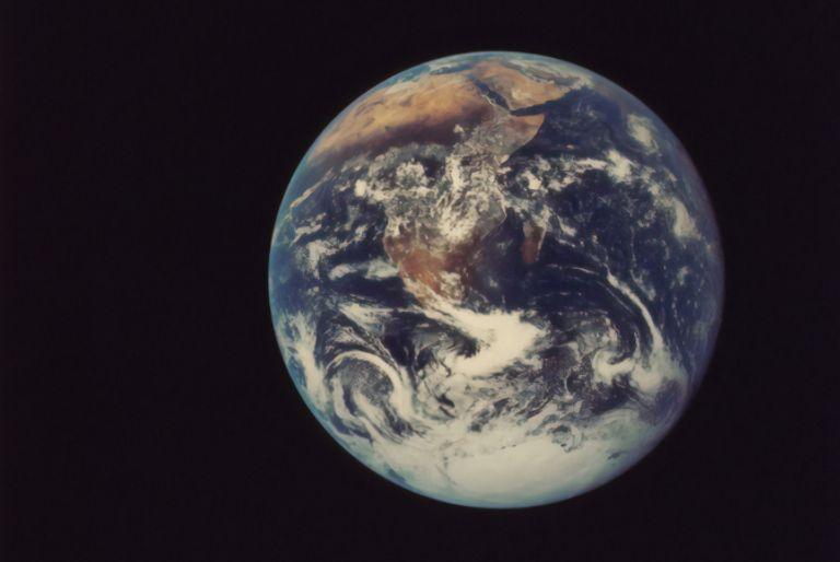The planet earth being viewed from space, where the effects of climate change are evident.