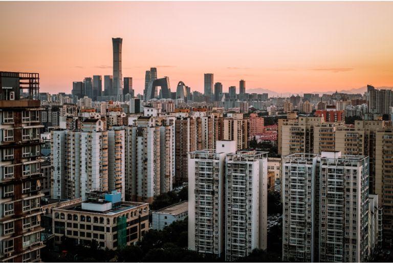 City in a developing country, where carbon emissions per person tend to be smaller on average.