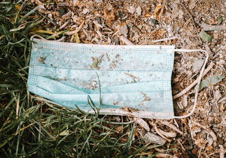 Single-use plastic mask contributing to plastic pollution.