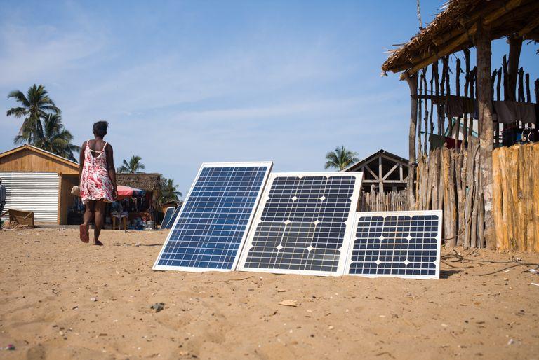 Solar panels in village in Africa as part of a local carbon offset project
