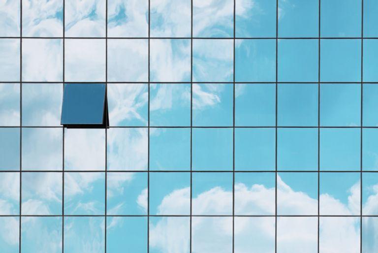 A skyscraper of an organization that uses carbon offsets to become carbon neutral