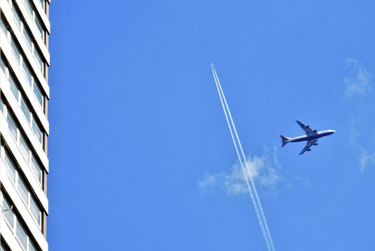 Airplanes leaving vapour trails with greenhouse gases that lead to climate change.