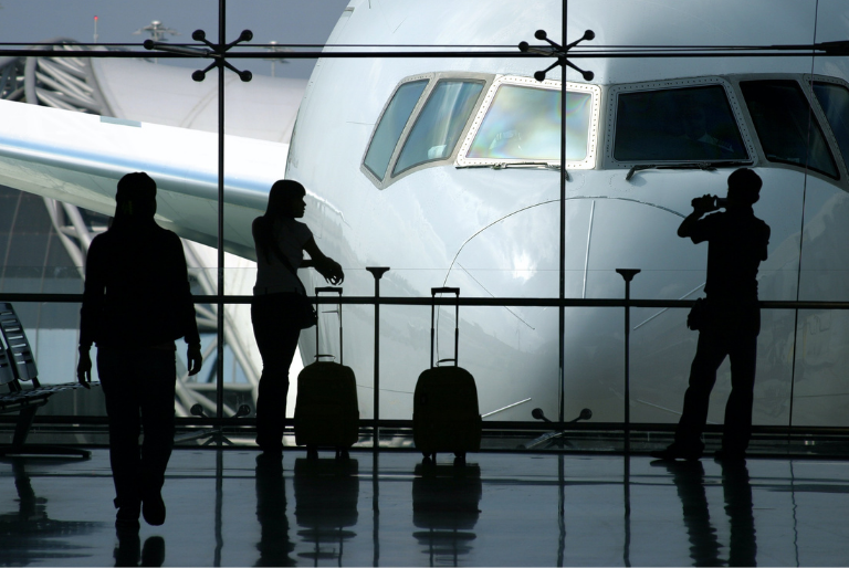 Passengers wait in an airport lounge