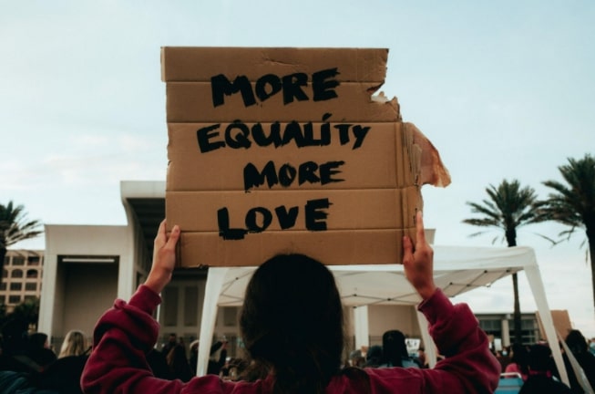 Sign that says "more equality more love"
