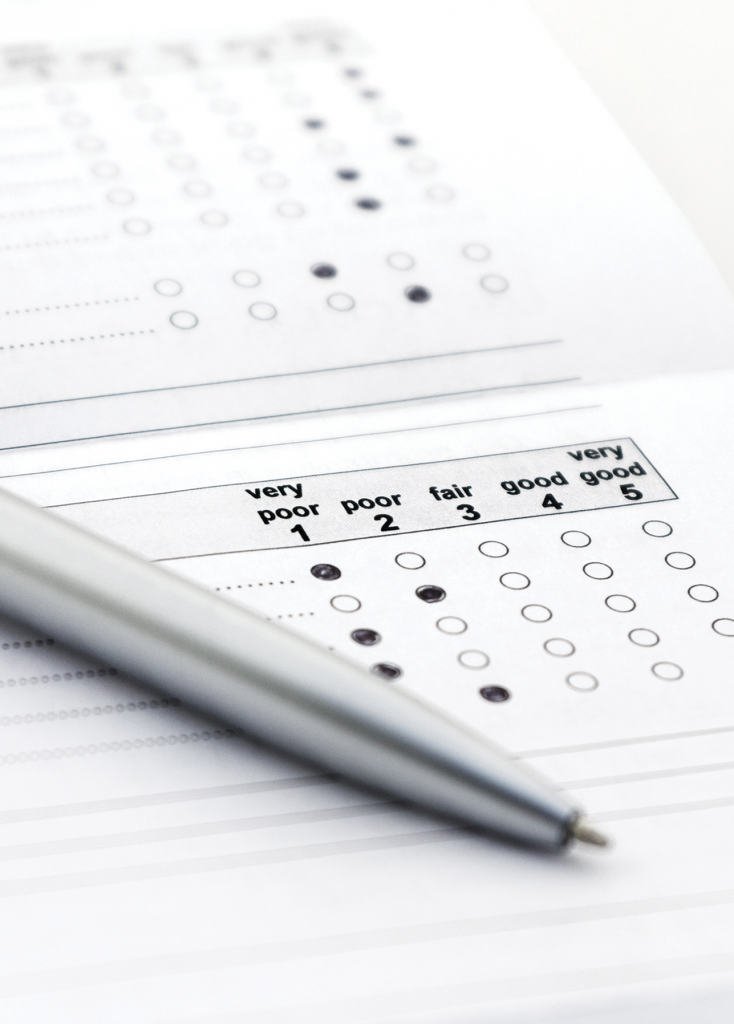 Picture of a half completed questionnaire and a pen
