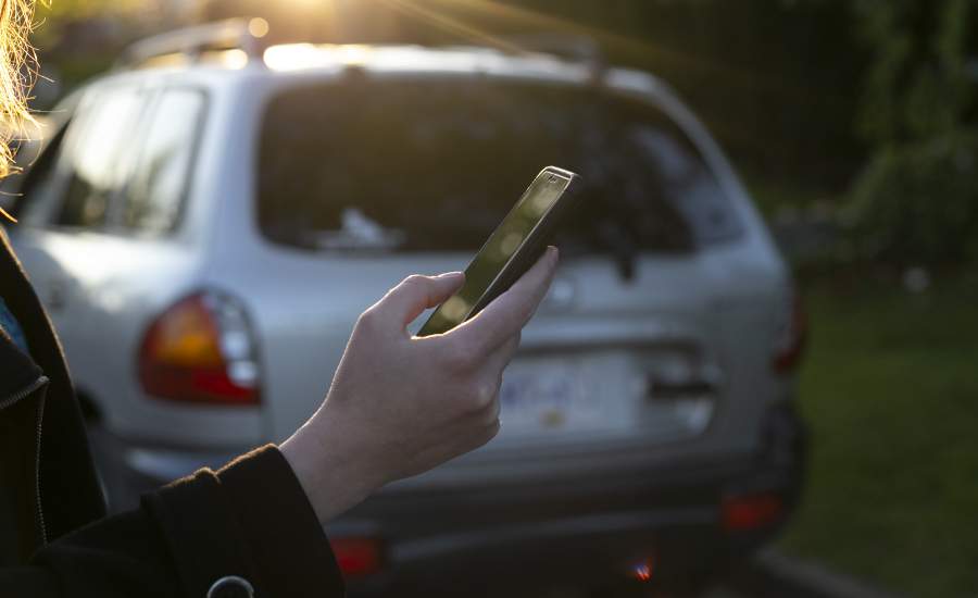 woman looking at smartphone