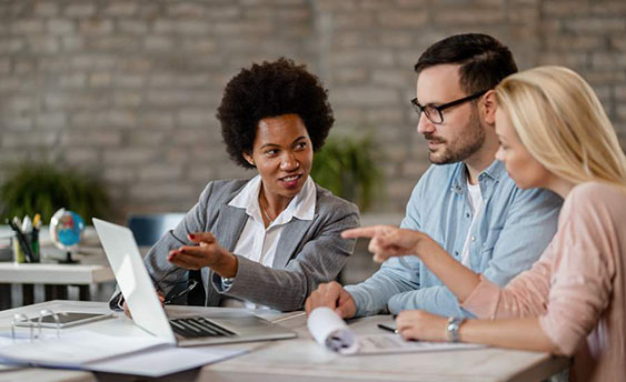 people discussing over laptop