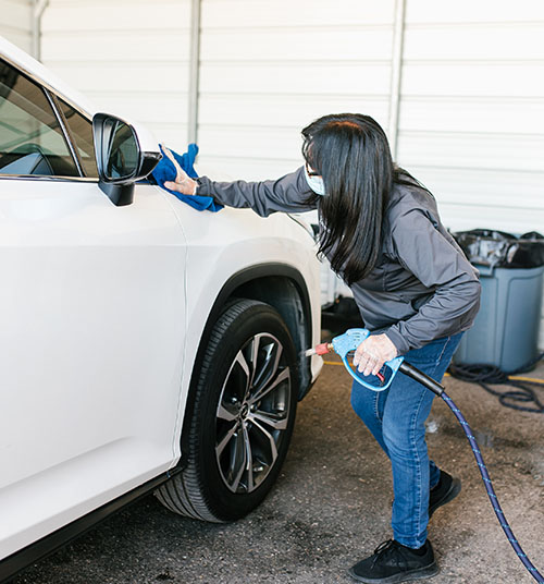 woman cleaning car