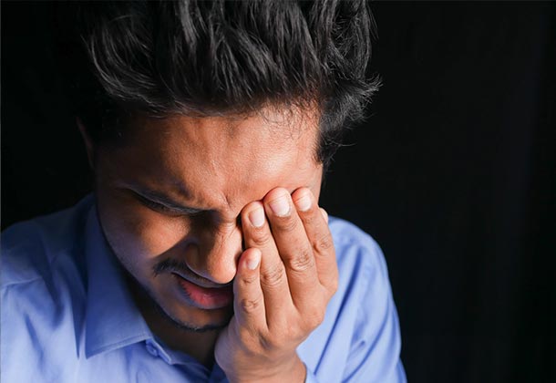 Man touching face