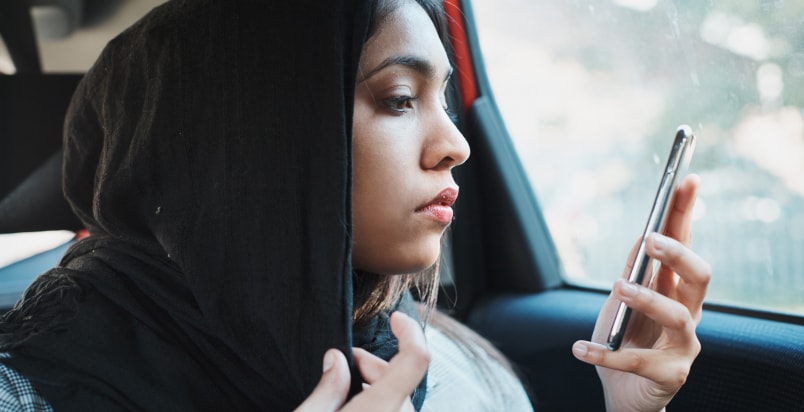woman looking at phone
