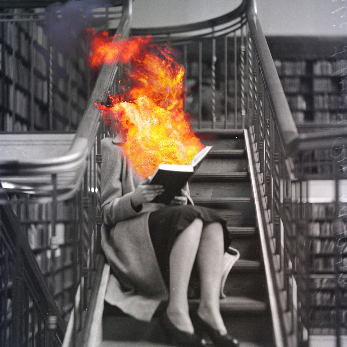 Woman reading a book with flames coming out of it