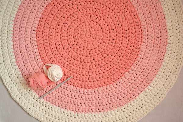 pink and white carpet made of yarn