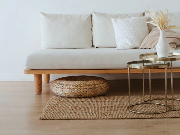solid wood flooring in living room with white sofa, and natural elements