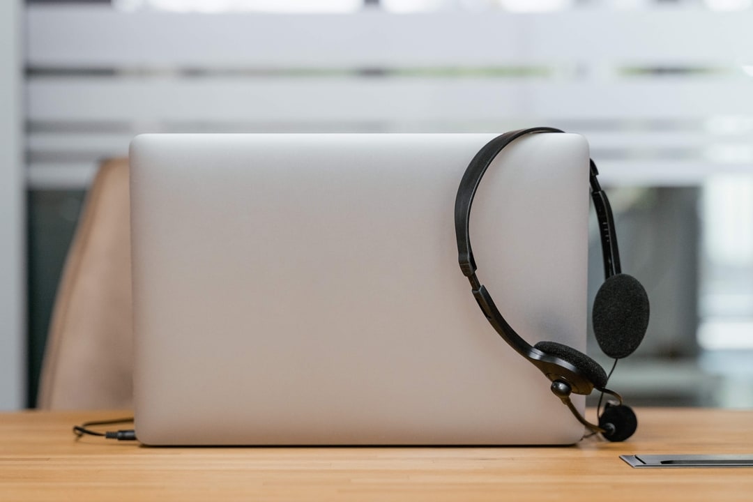 A laptop with a headset