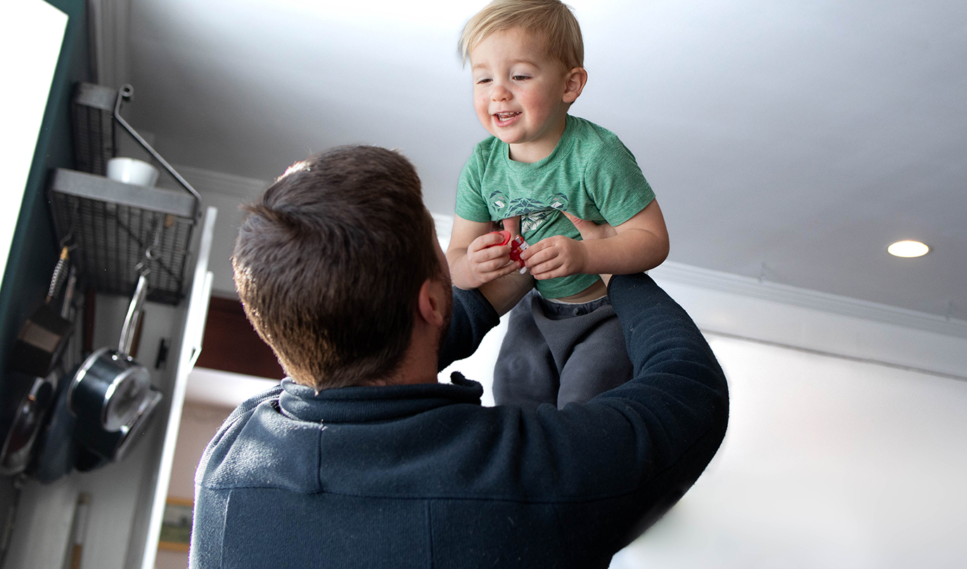 Father Holding Child
