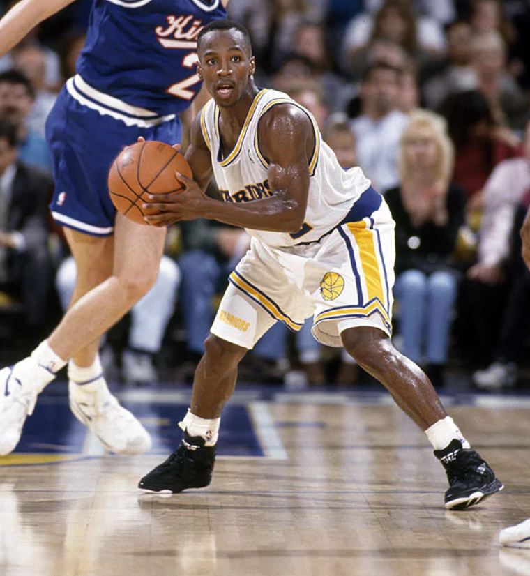 Keith Jennings with the ball headed to the hoop as one of the smallest players in the 90s