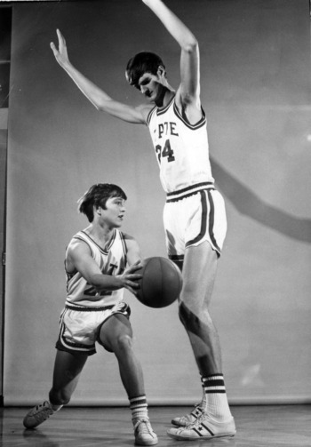 Monte Towe at 5'7" posed against an average high basketball player