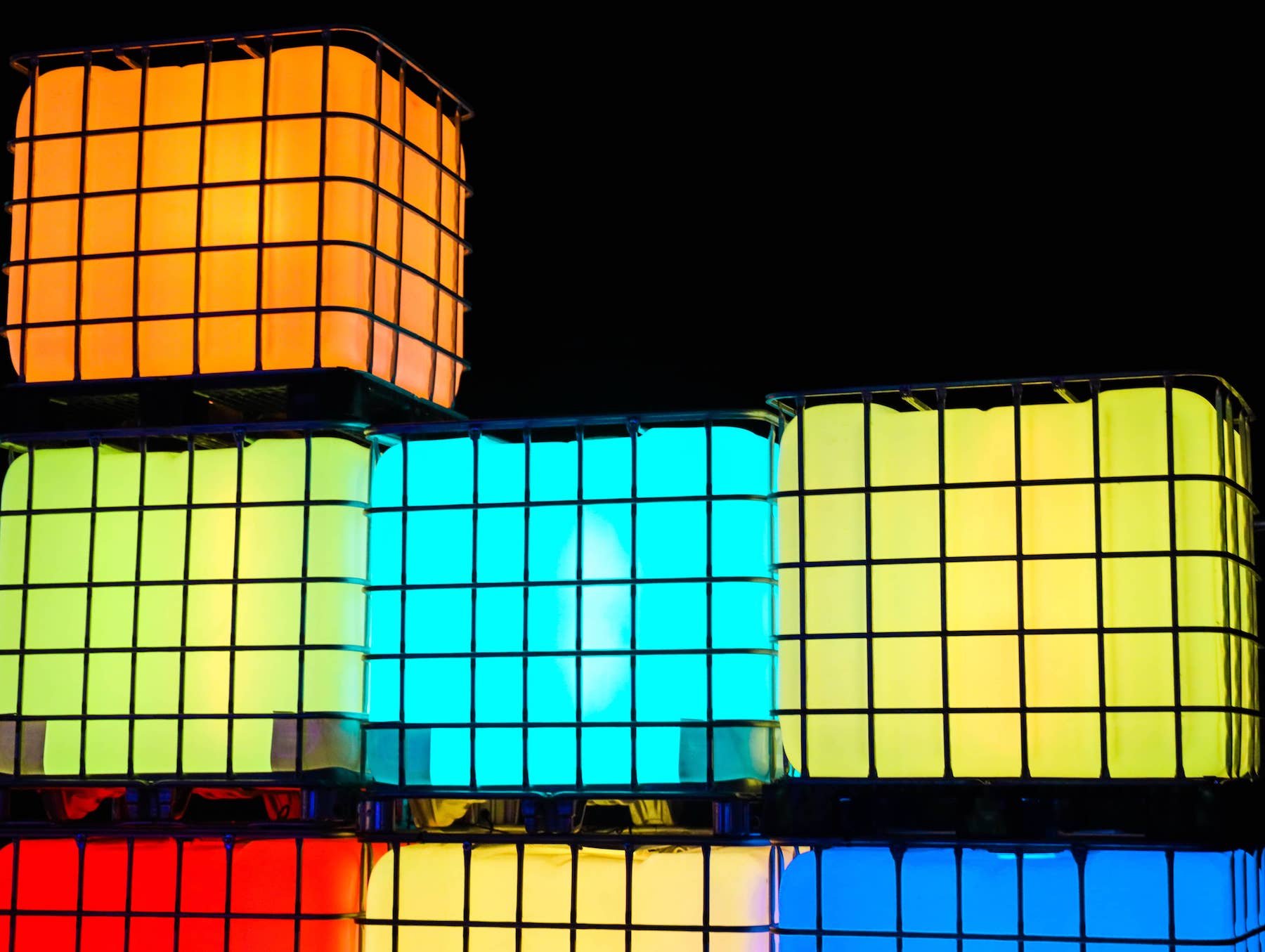 Large lighted cubes in cages