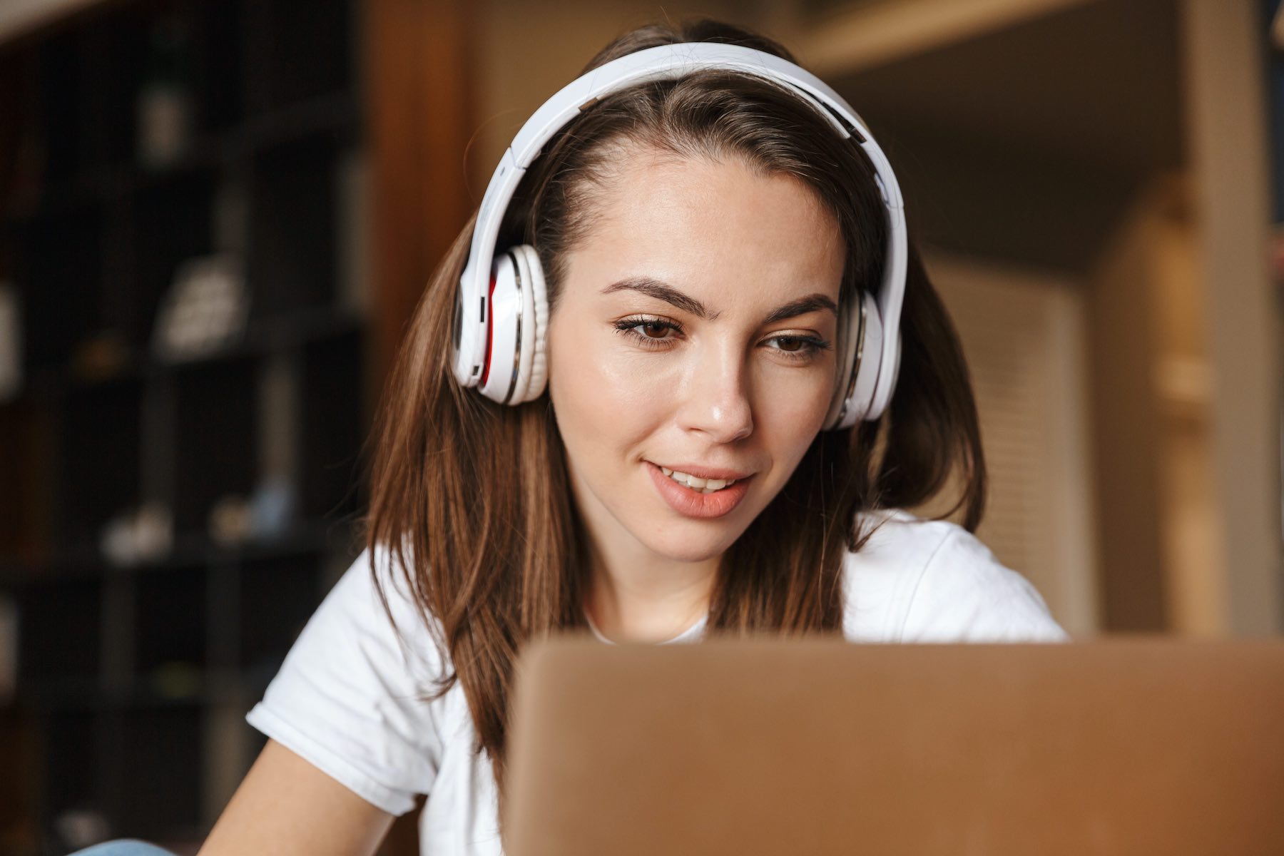 happy woman on video therapy session for ketamine treatment