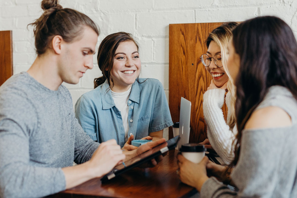 Image of co-workers coordinating together as a team in the office.