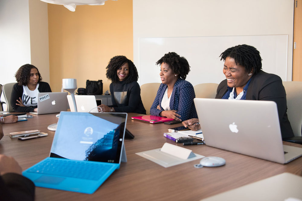 Women working together safely in the office.