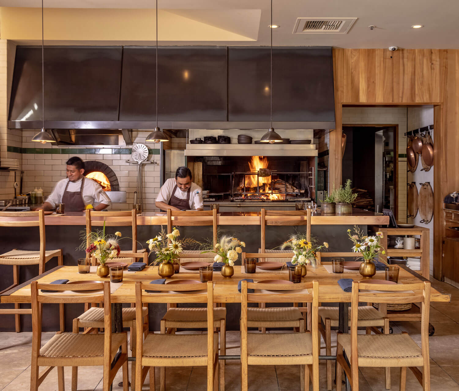 People cooking in the Cotogna dining room
