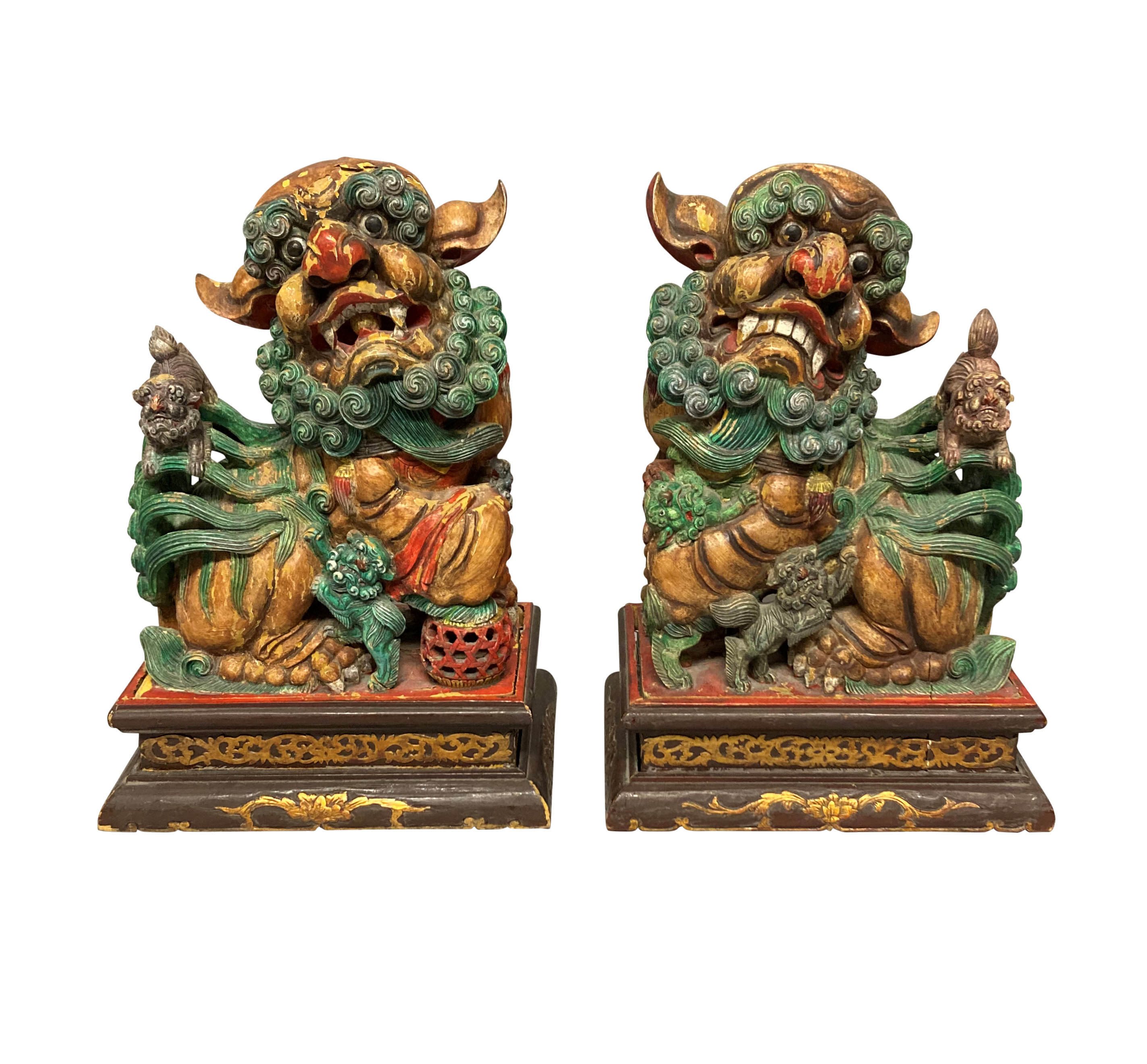 A PAIR OF CHINESE POLYCHROME PAINTED FOO DOGS Ebury Trading
