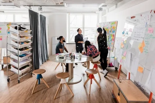 A photo of a group of people in a workshop