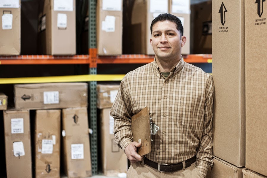 Man in warehouse with clipboard