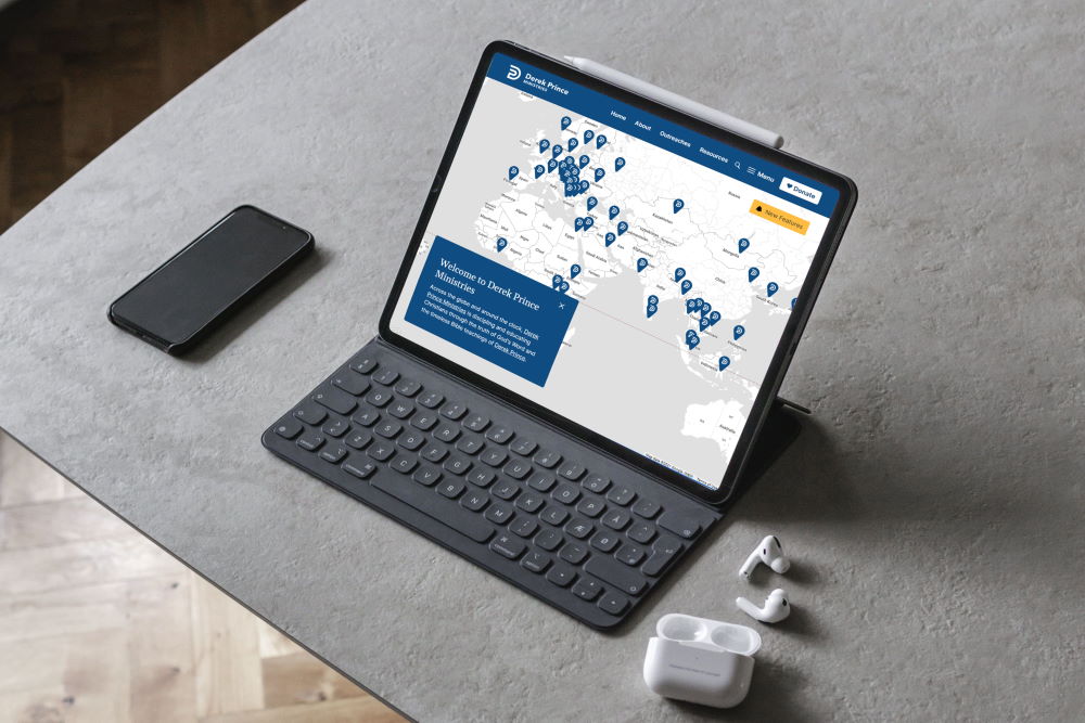 An iPad on a table with the Derek Prince Ministries website displayed