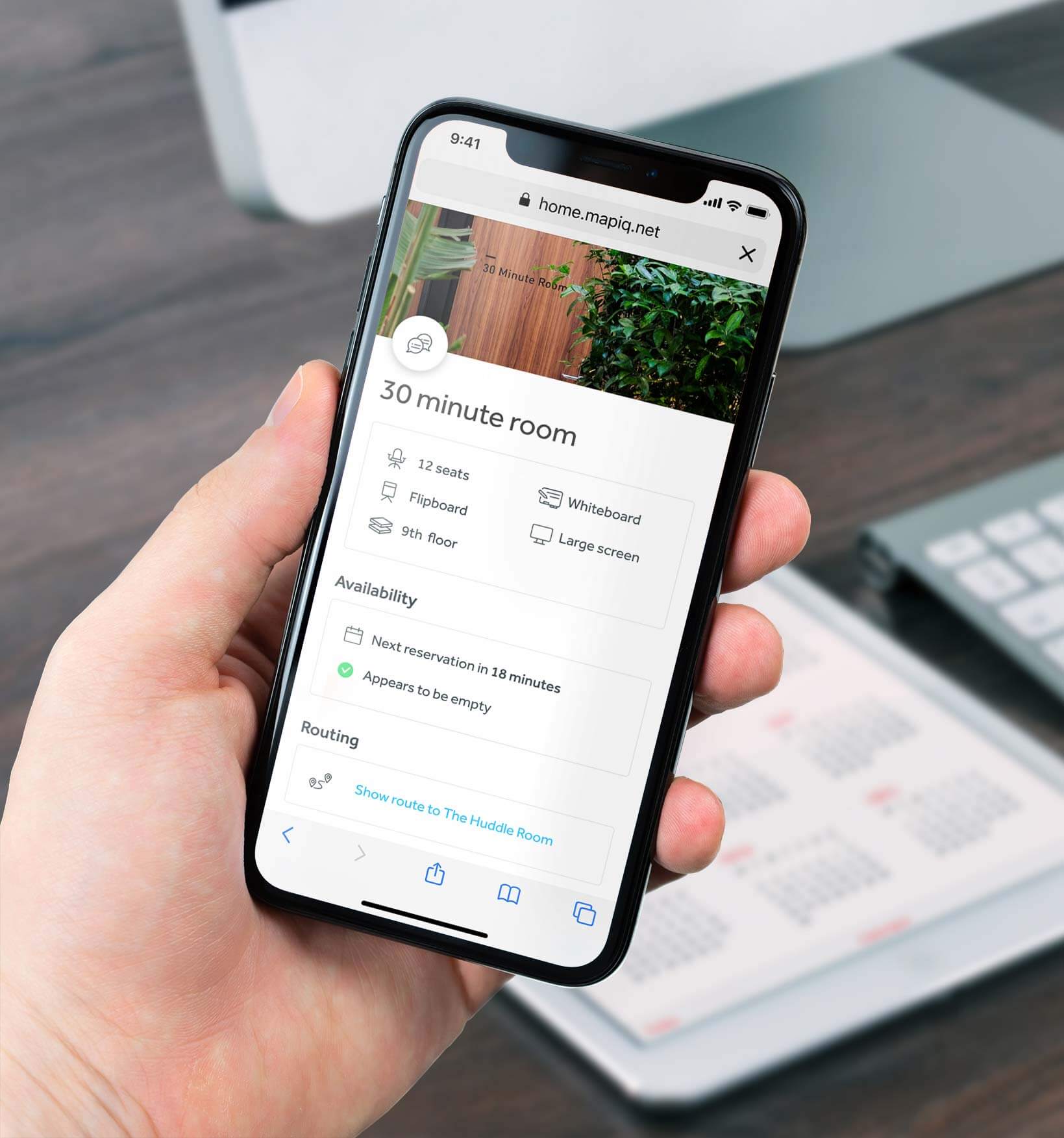 Person using Mapiq app on a phone