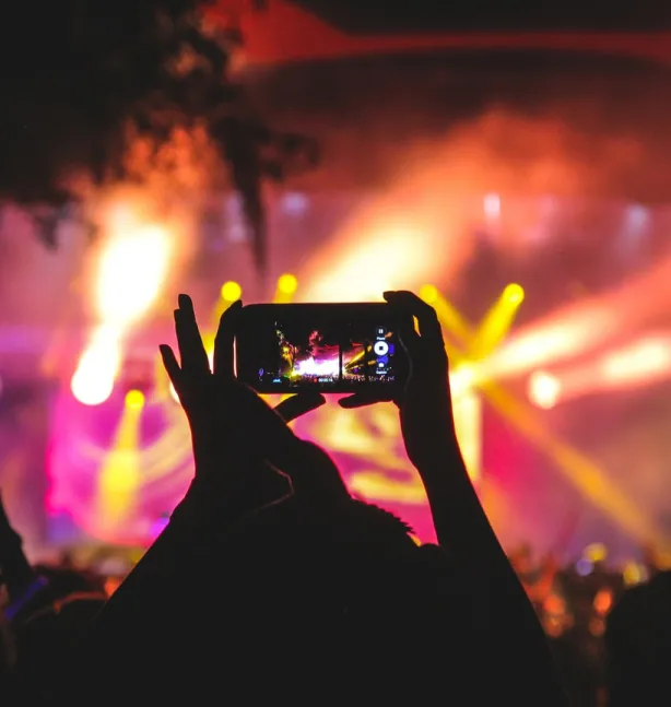 camera taking a photo of a concert